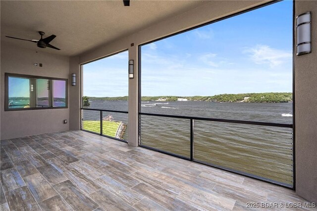 1536 Shootout Dr, Osage Beach, MO 65065 - unfurnished sunroom featuring wood finished floors