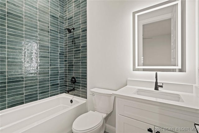 full bathroom featuring tiled shower / bath combo, toilet, and vanity