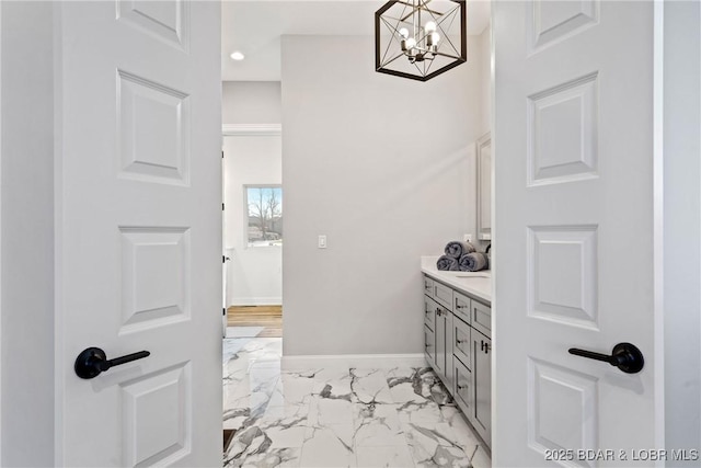 1536 Shootout Dr, Osage Beach, MO 65065 - bathroom featuring marble look tiles, vanity, a chandelier, baseboards, and recessed lighting