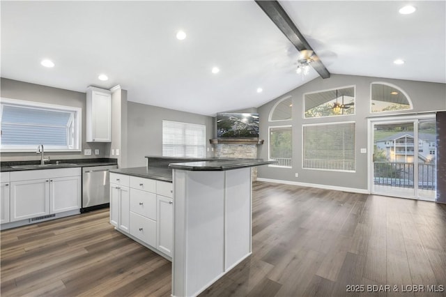 kitchen featuring white cabinetry, sink, a center island, stainless steel dishwasher, and dark wood-type flooring