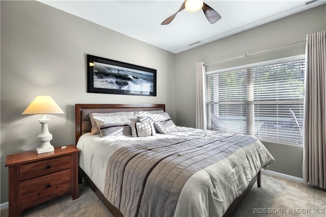 bedroom featuring light carpet and ceiling fan