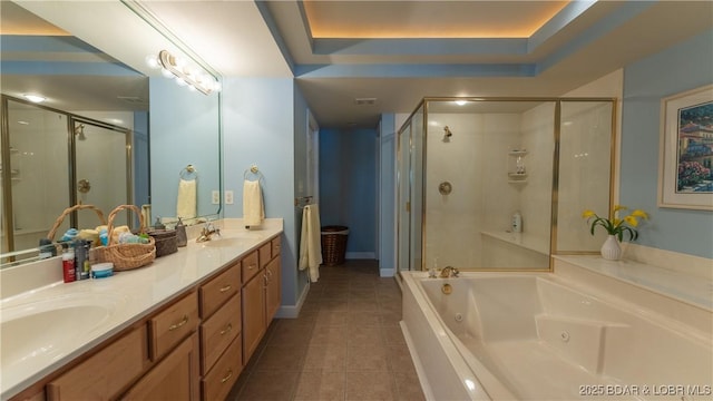 bathroom with separate shower and tub, a raised ceiling, tile patterned flooring, and vanity