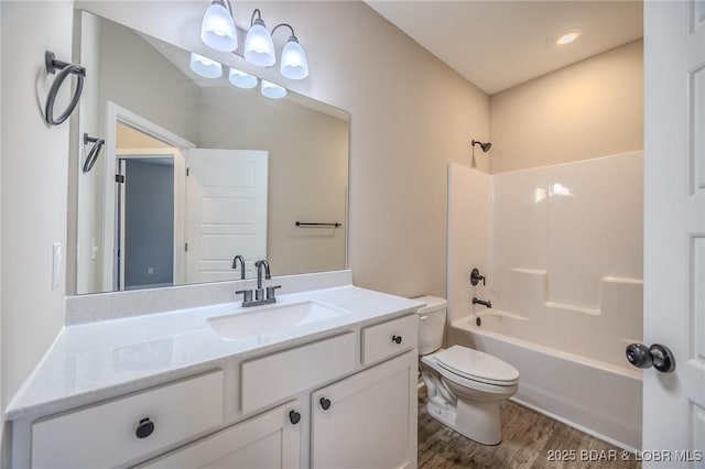 full bathroom featuring shower / bathing tub combination, vanity, toilet, and wood-type flooring