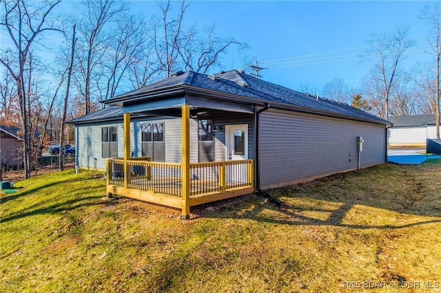 view of home's exterior featuring a yard and a deck