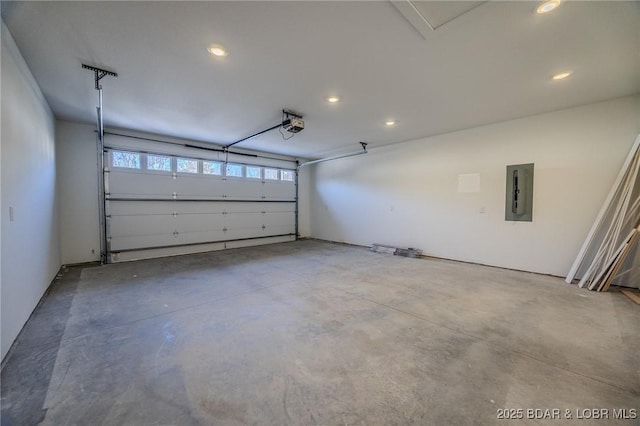 garage with electric panel and a garage door opener