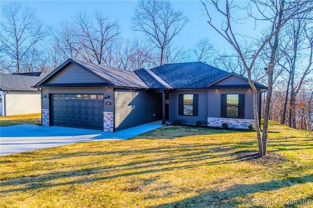 view of front of property with a front lawn and a garage