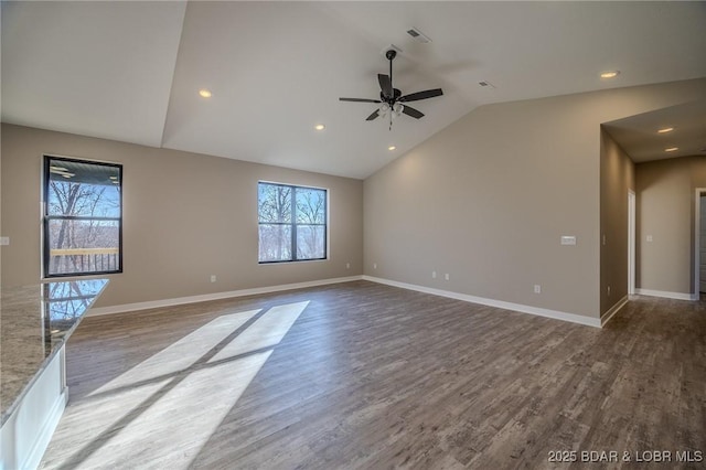 empty room featuring ceiling fan, lofted ceiling, and hardwood / wood-style flooring