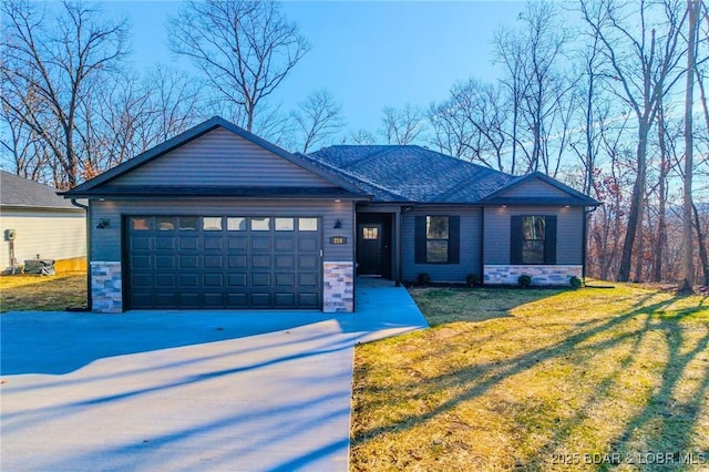 view of front facade with a garage and a front lawn