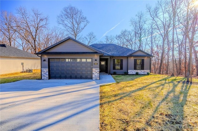 view of front of house with a front yard and a garage