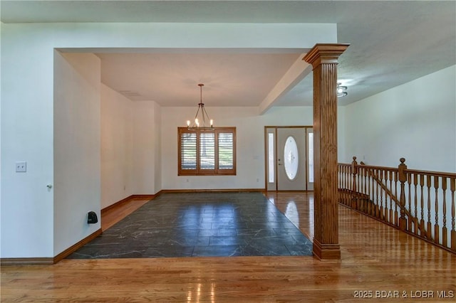 foyer with a notable chandelier