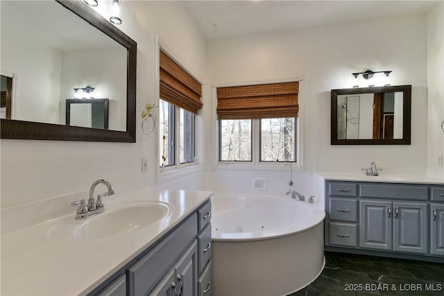 bathroom featuring a tub to relax in and vanity