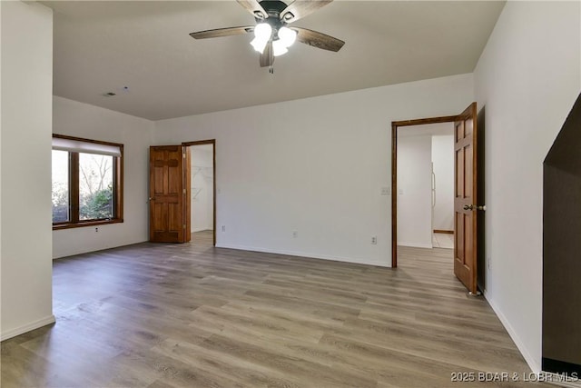 spare room with ceiling fan and light hardwood / wood-style floors