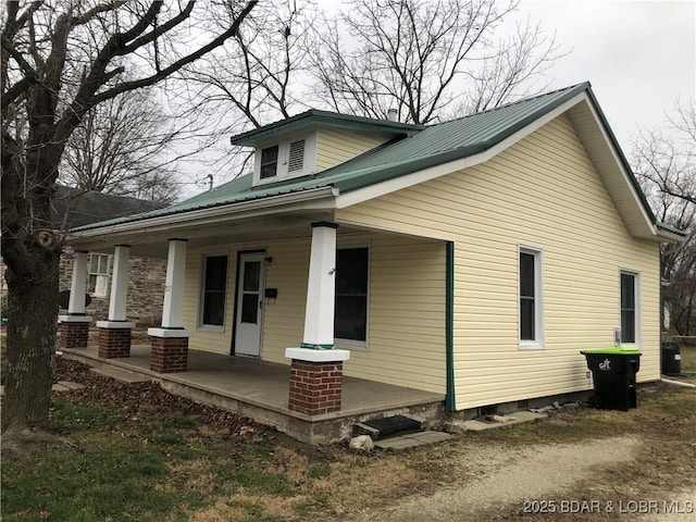 view of side of home with a porch