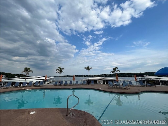 view of swimming pool with a patio