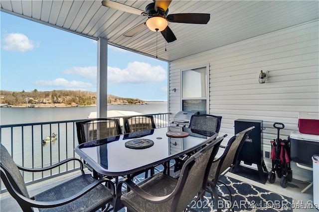 exterior space featuring a water view, grilling area, a balcony, and ceiling fan