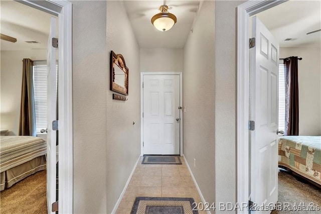 corridor with light tile patterned flooring