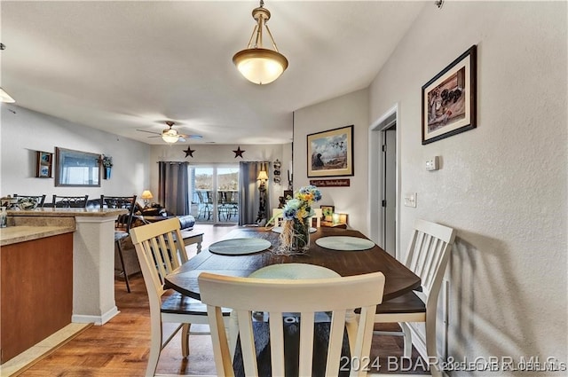 dining area featuring ceiling fan and light hardwood / wood-style floors