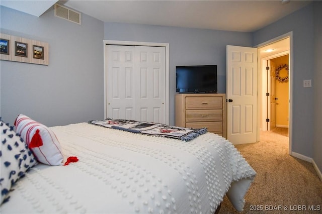 carpeted bedroom with a closet