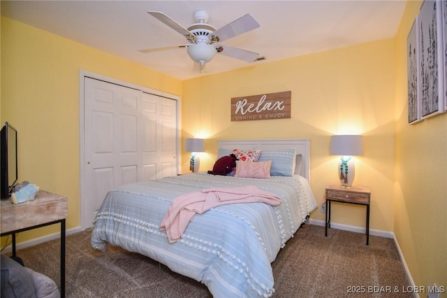 carpeted bedroom featuring ceiling fan and a closet