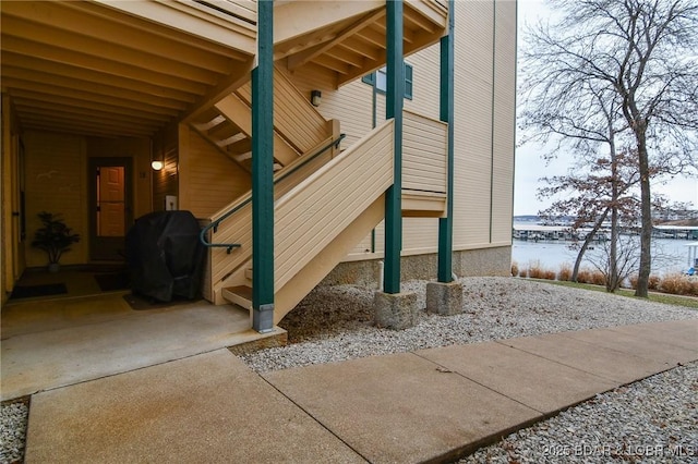 view of side of home with a water view