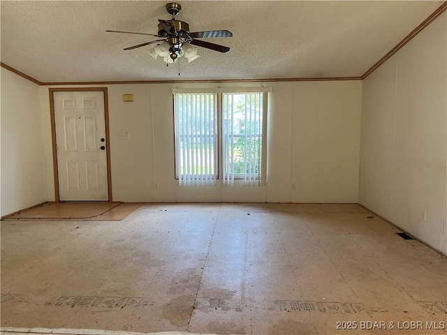 interior space featuring ceiling fan and a textured ceiling