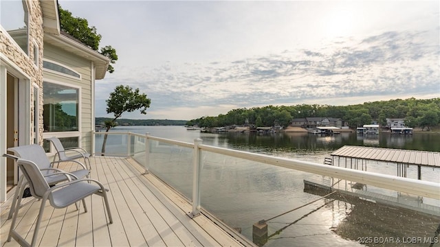 wooden deck with a water view