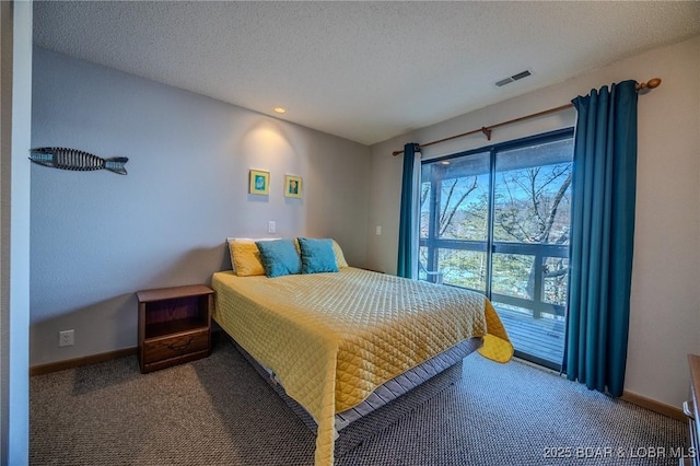 bedroom featuring carpet, a textured ceiling, and access to outside