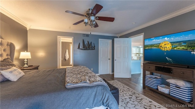 bedroom featuring ensuite bathroom, ceiling fan, crown molding, and dark hardwood / wood-style floors