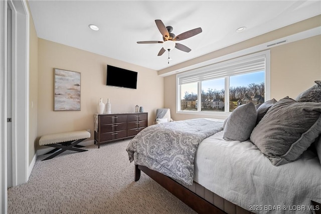 carpeted bedroom with visible vents, ceiling fan, and recessed lighting
