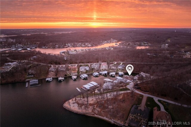 aerial view at dusk with a water view