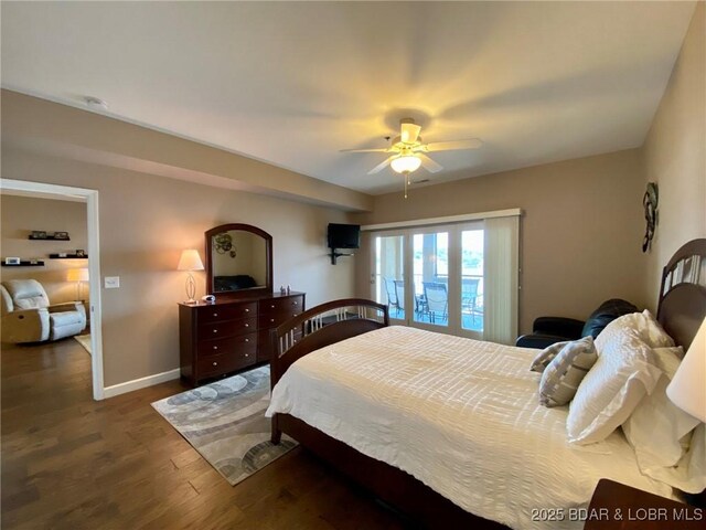 bedroom with dark hardwood / wood-style floors and ceiling fan