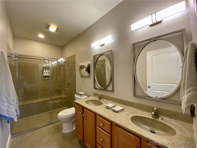 bathroom featuring walk in shower, vanity, and toilet