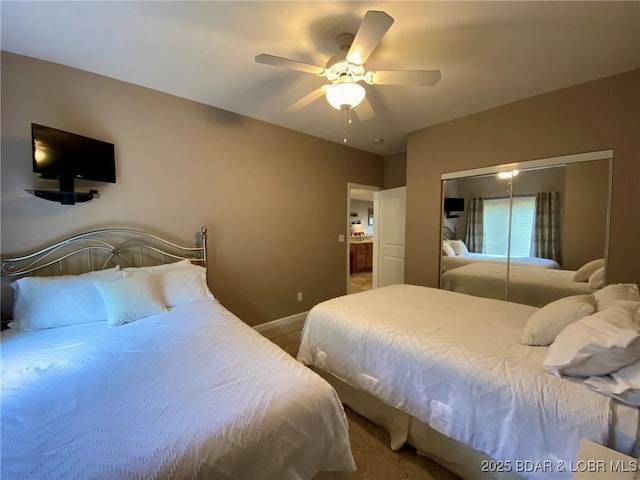 bedroom with ceiling fan and a closet