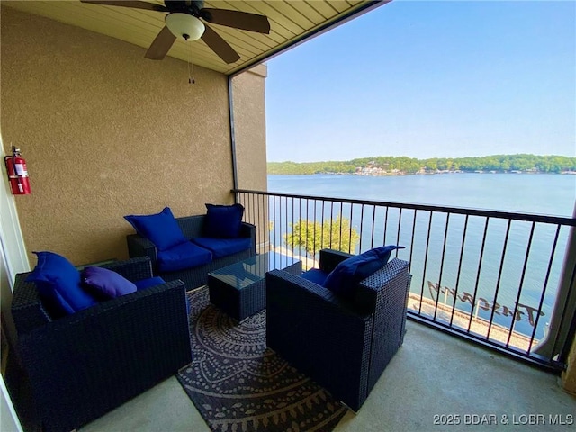 balcony with outdoor lounge area and a water view