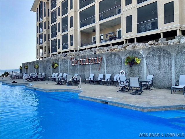 view of swimming pool with a patio