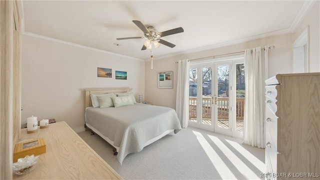 carpeted bedroom with access to exterior, ceiling fan, and crown molding