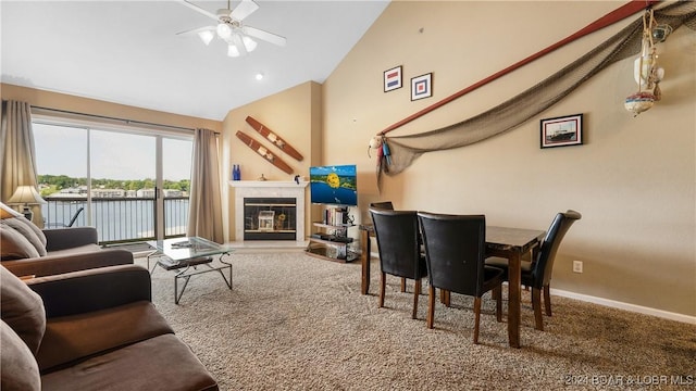 living room featuring carpet, ceiling fan, and lofted ceiling