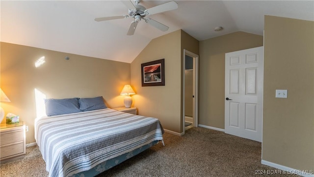 bedroom with ceiling fan, carpet floors, and vaulted ceiling