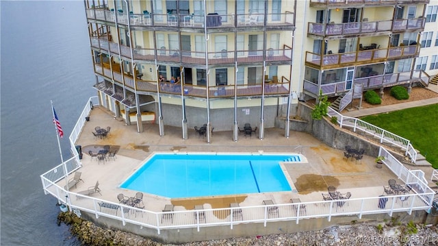 view of swimming pool with a water view