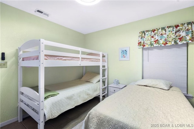 bedroom featuring dark tile patterned floors