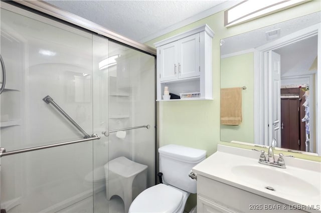 bathroom with toilet, a textured ceiling, walk in shower, and vanity