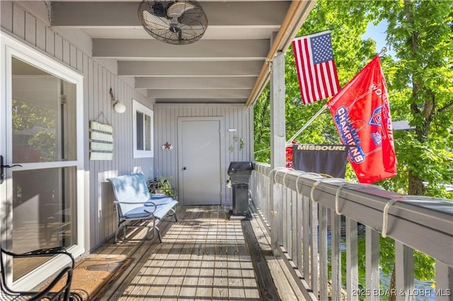 exterior space with ceiling fan