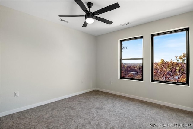 unfurnished room featuring carpet flooring and ceiling fan