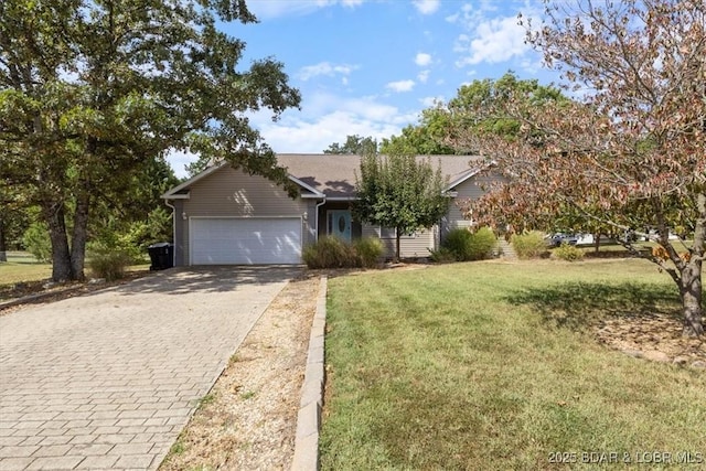 view of front of property featuring a front yard and a garage