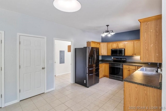 kitchen featuring pendant lighting, electric panel, sink, light tile patterned floors, and stainless steel appliances