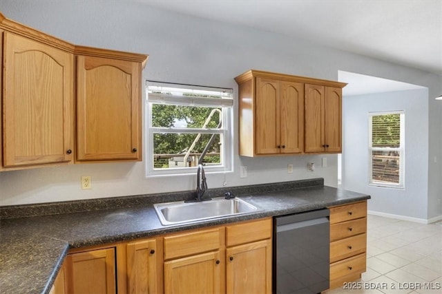 kitchen with dishwasher, light tile patterned flooring, sink, and a wealth of natural light