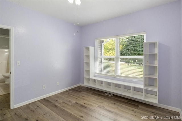 unfurnished room with light hardwood / wood-style floors