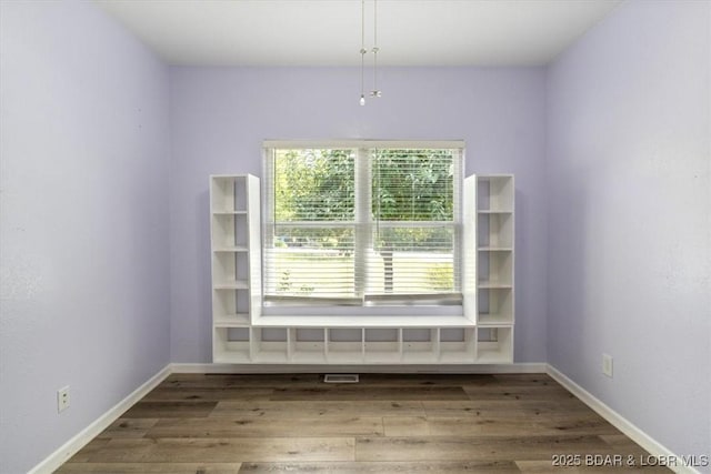 empty room with wood-type flooring