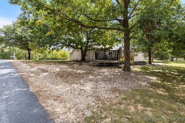 view of front of house with a trampoline