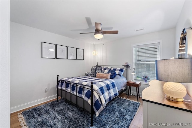 bedroom featuring ceiling fan and wood-type flooring